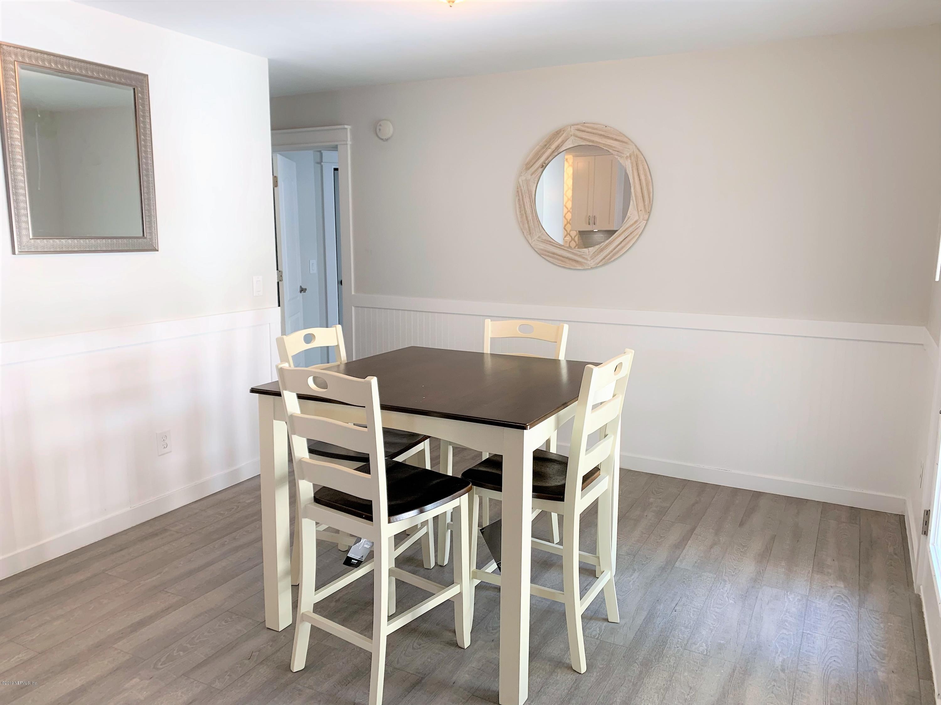 3300 Turtle Creek Road St. Augustine, FL 32086 - Photo 16 of 35 a view of a dining room with furniture and wooden floor