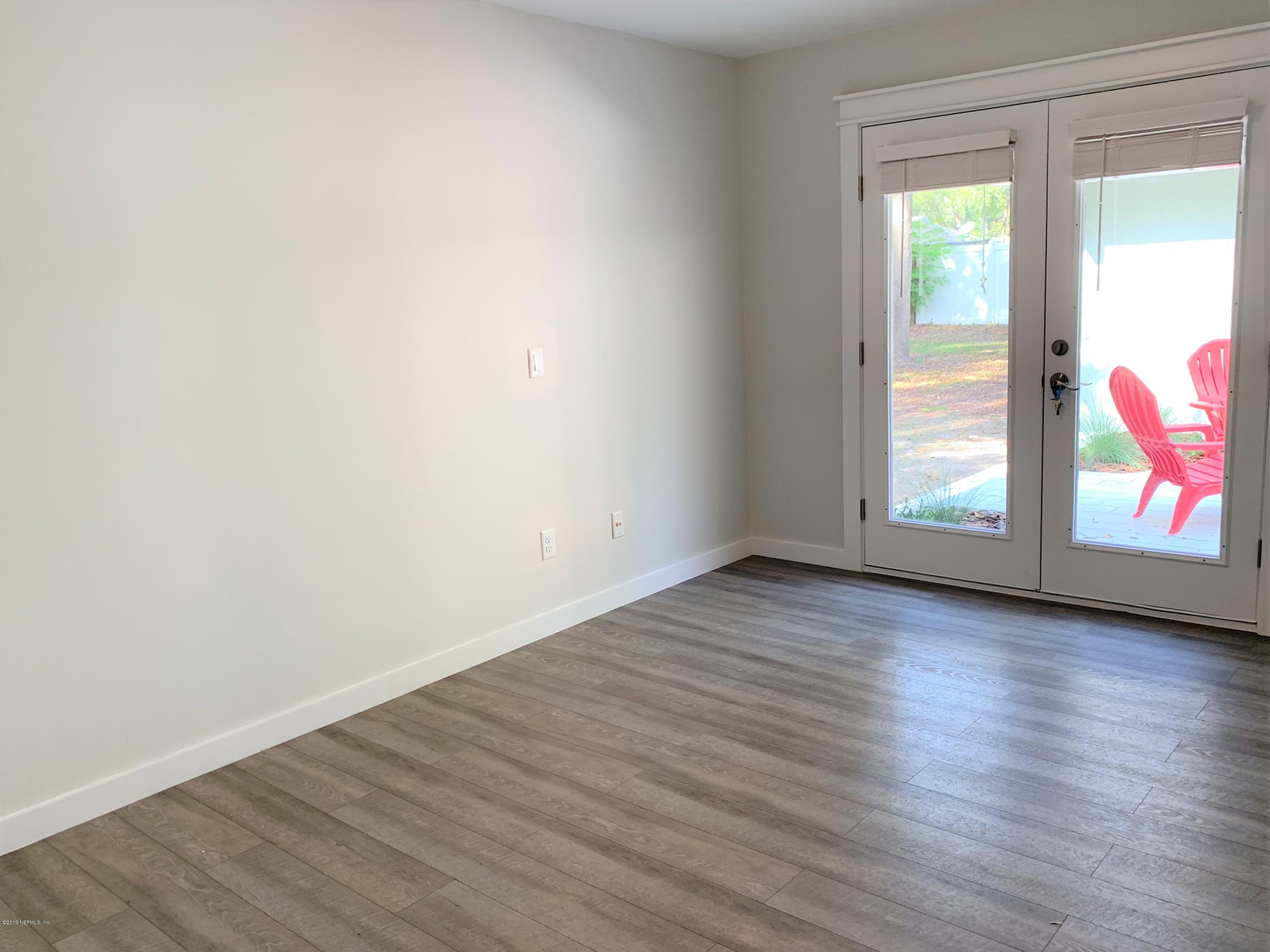 3300 Turtle Creek Road St. Augustine, FL 32086 - Photo 18 of 35 an empty room with wooden floor and windows