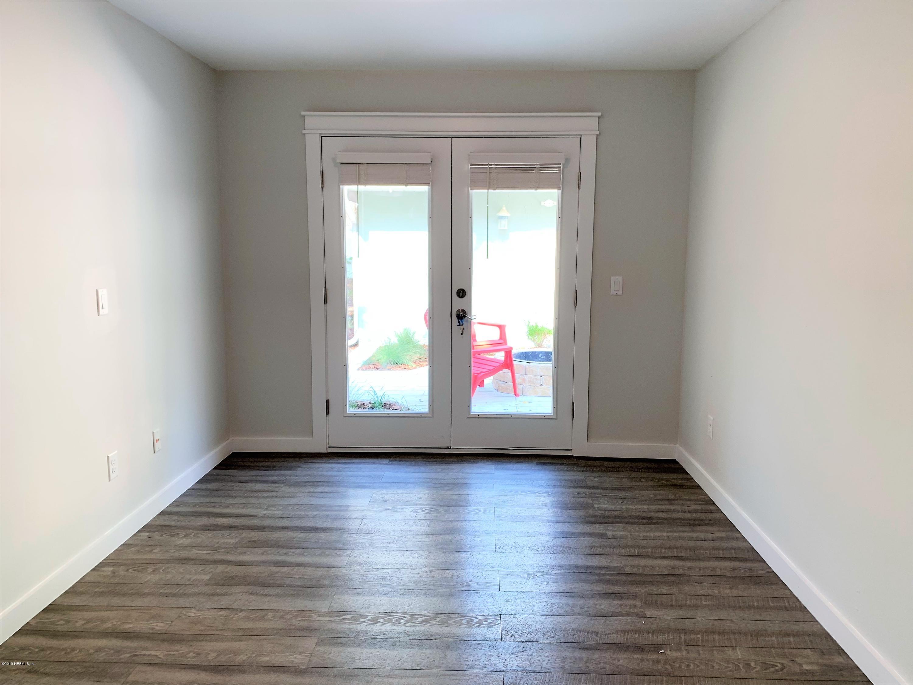 3300 Turtle Creek Road St. Augustine, FL 32086 - Photo 19 of 35 a view of an empty room with wooden floor and a window