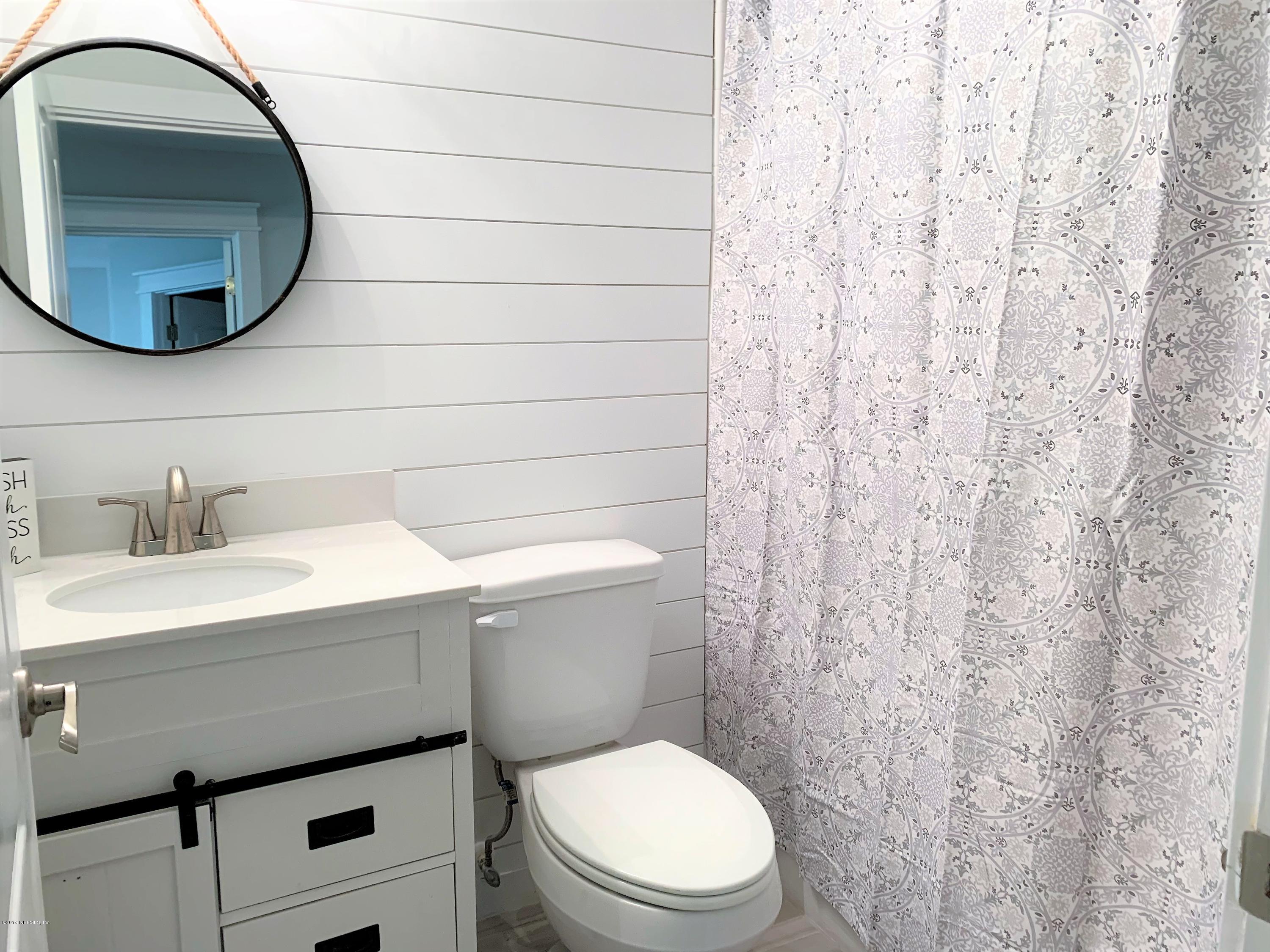 3300 Turtle Creek Road St. Augustine, FL 32086 - Photo 20 of 35 a bathroom with a sink toilet and mirror