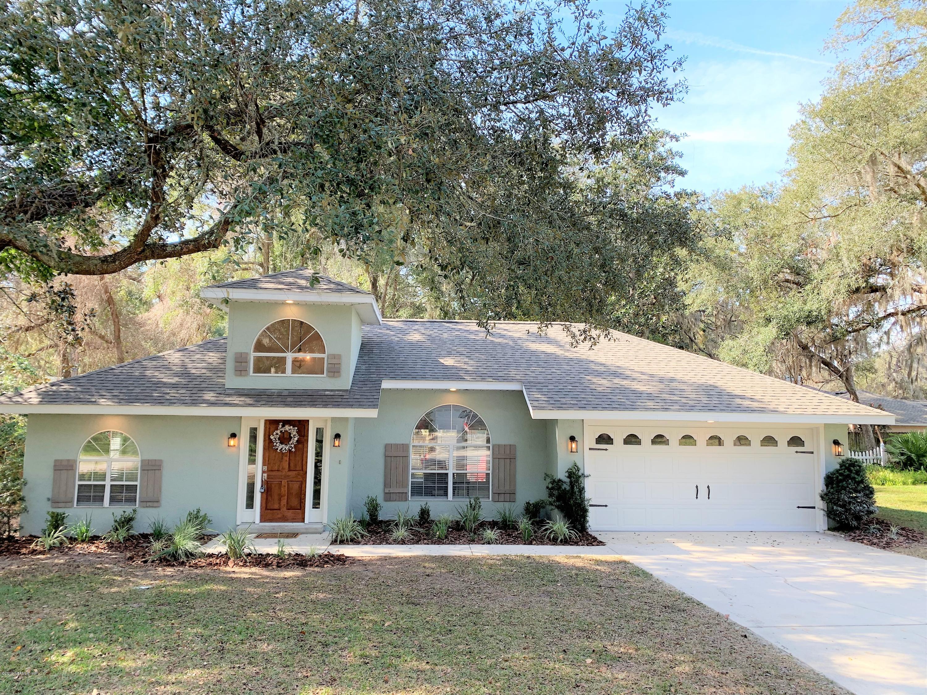 3300 Turtle Creek Road St. Augustine, FL 32086 - Photo 2 of 35 a front view of a building with retail shop and garage