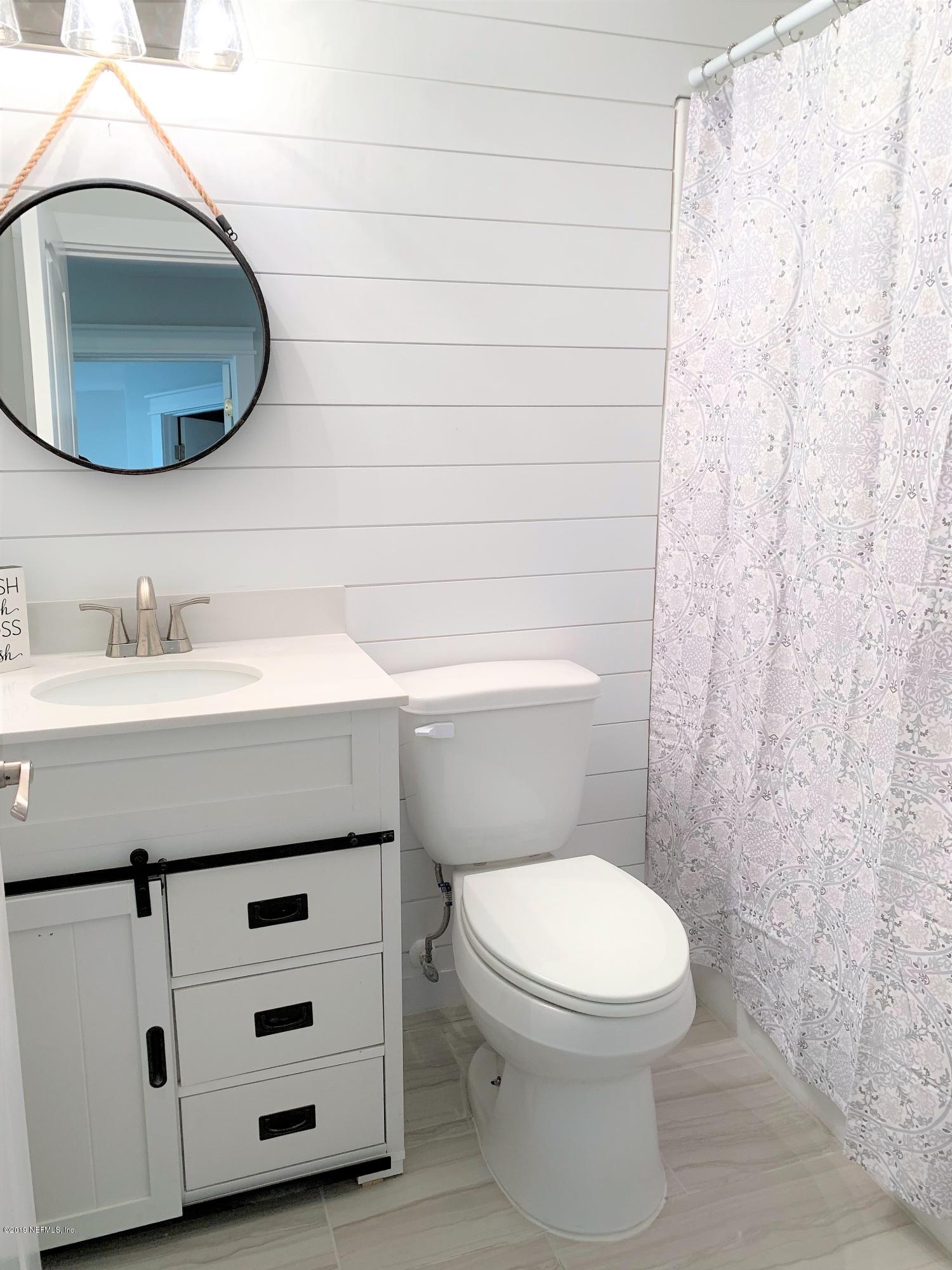 3300 Turtle Creek Road St. Augustine, FL 32086 - Photo 21 of 35 a bathroom with a toilet a sink and vanity