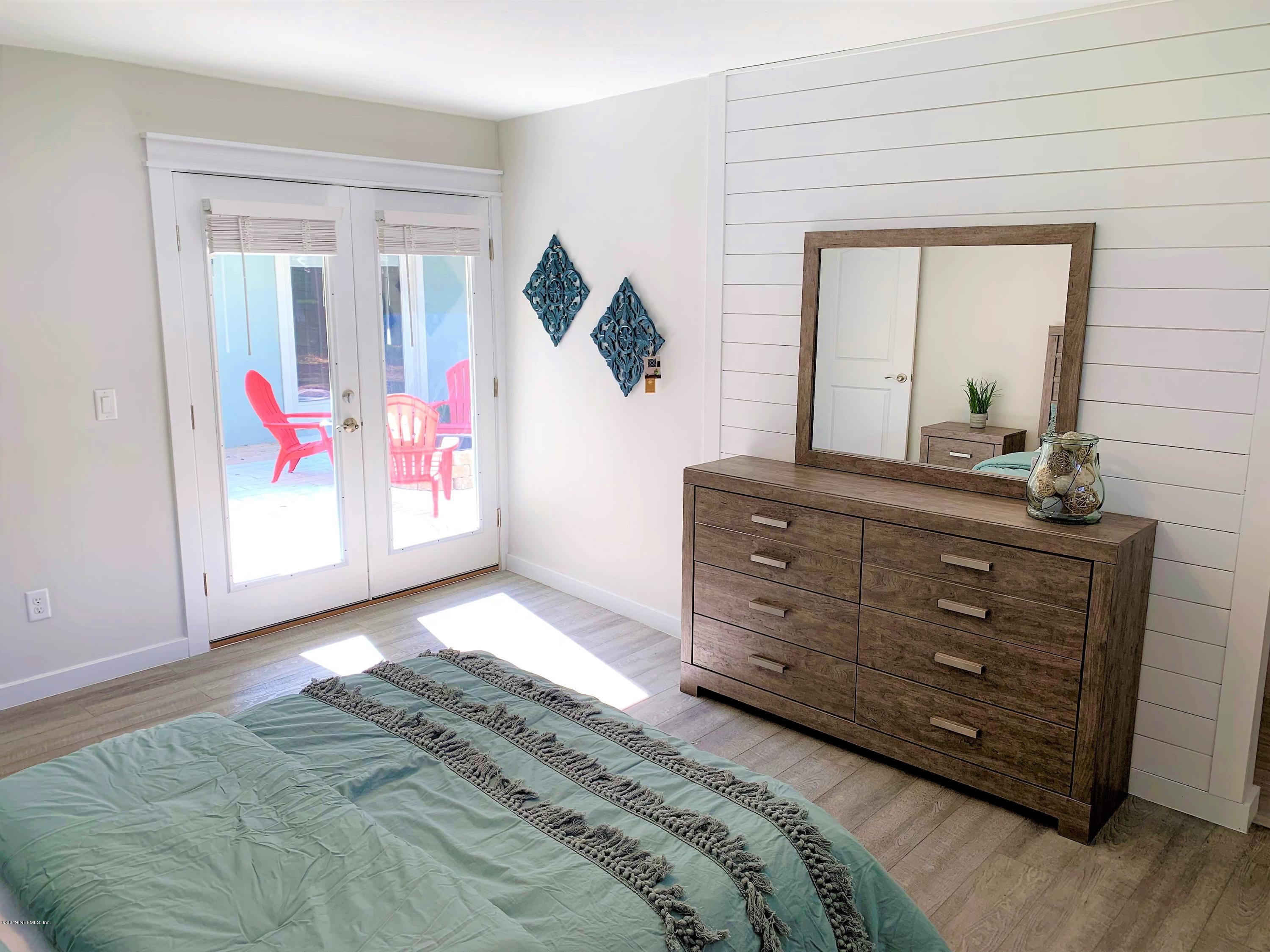 3300 Turtle Creek Road St. Augustine, FL 32086 - Photo 26 of 35 a bedroom with a bed and a dresser