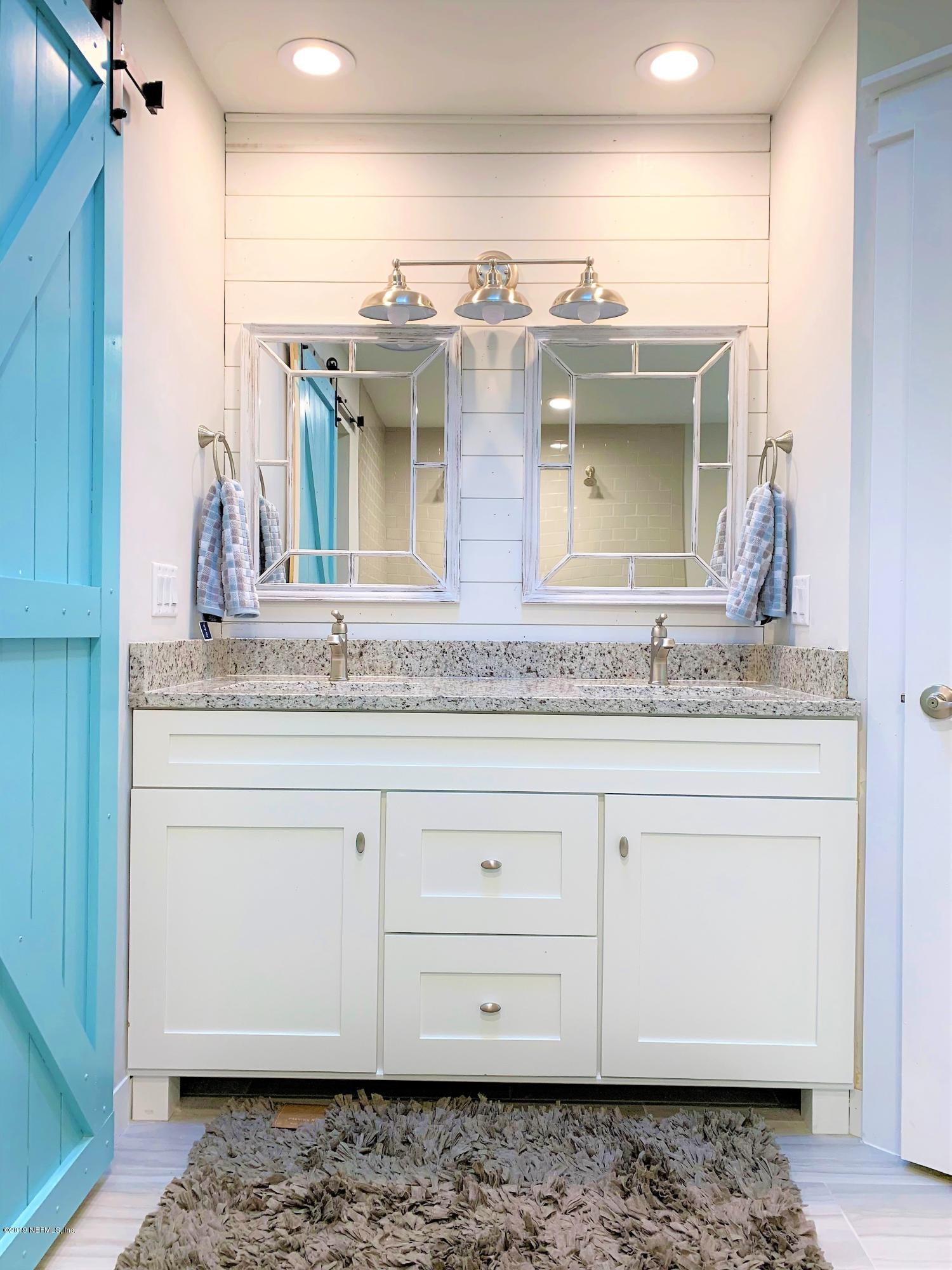 3300 Turtle Creek Road St. Augustine, FL 32086 - Photo 28 of 35 a bathroom with a sink and a mirror