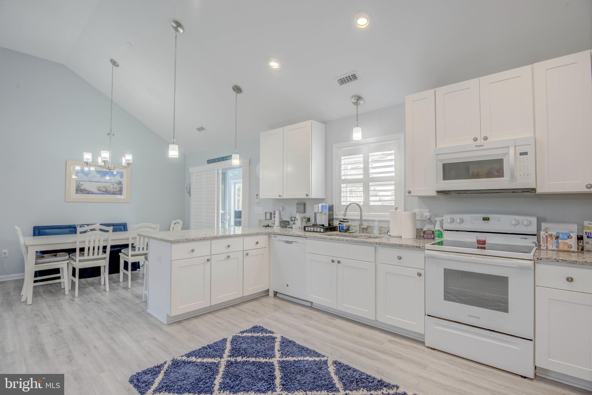 10242 Golf Course Road Ocean City, MD 21842 - Photo 4 of 55 Kitchen with bar seating