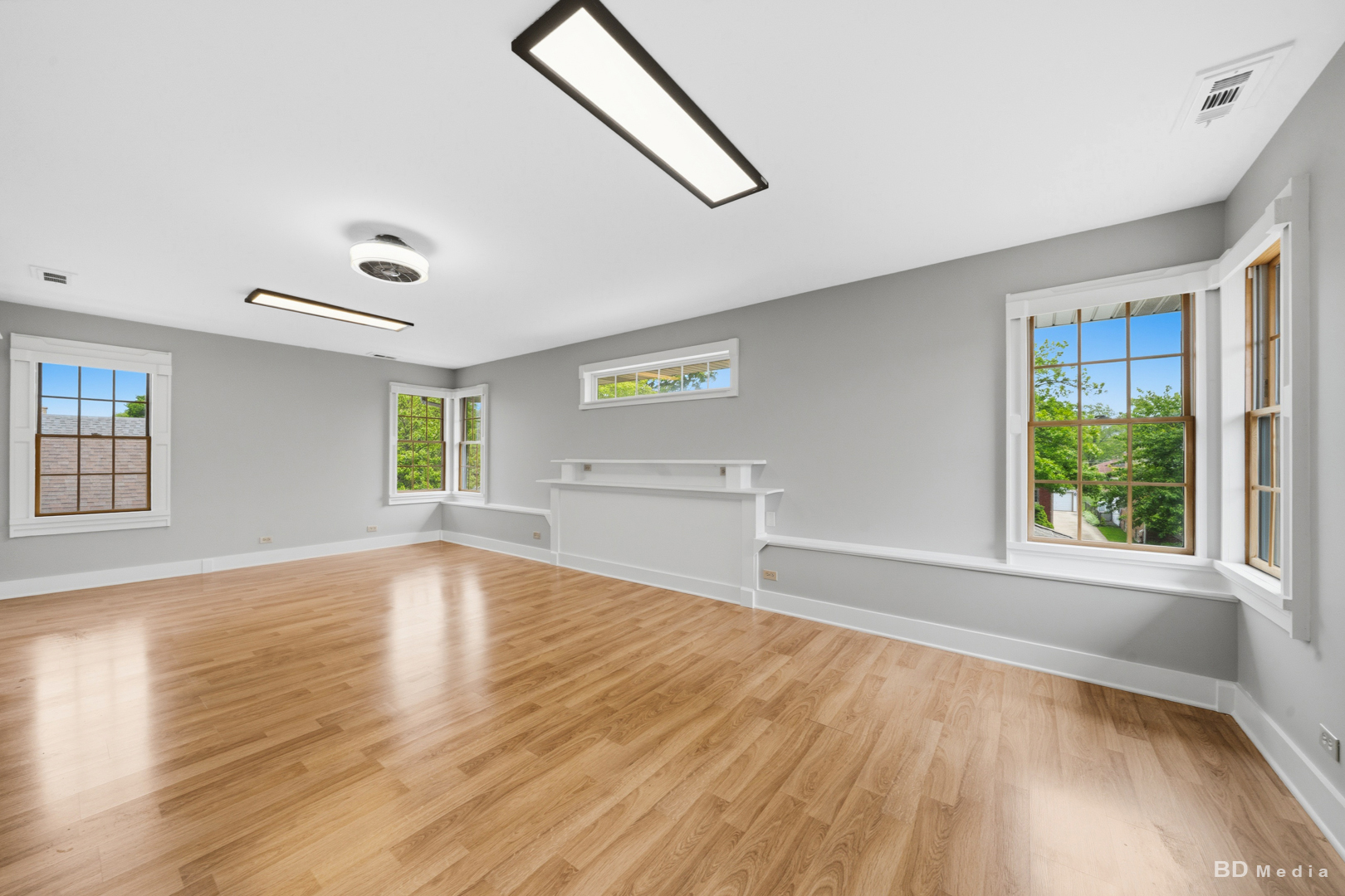 10428 South Springfield Avenue Chicago, IL 60655 - Photo 20 of 43 an empty room with wooden floor and windows
