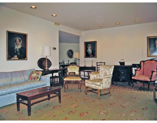 99 Codman Road Brookline, MA 02445 - Photo 2 of 8 a living room with furniture and a chair