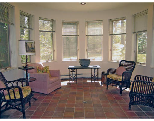 99 Codman Road Brookline, MA 02445 - Photo 6 of 8 a living room with furniture a rug a lamp and a window