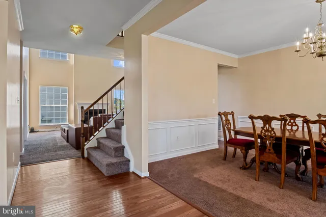 a view of a livingroom with furniture and hardwood floor