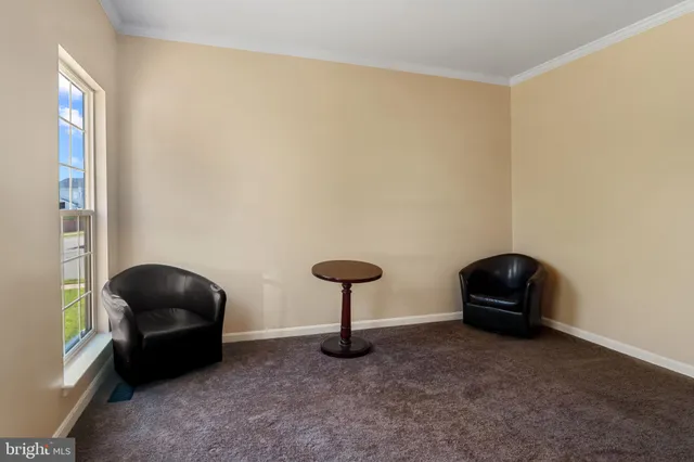 a bedroom with a chair and a grill