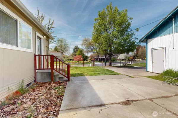 a view of a building with a yard