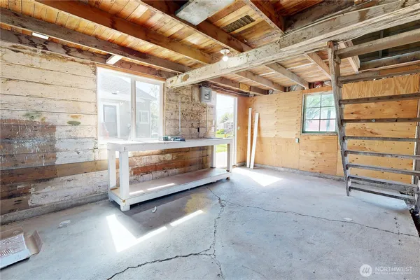 a view of an empty room with a fireplace