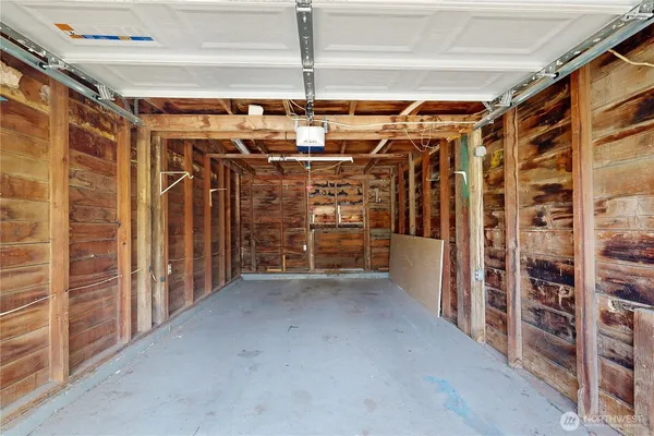 a view of empty room with wooden walls