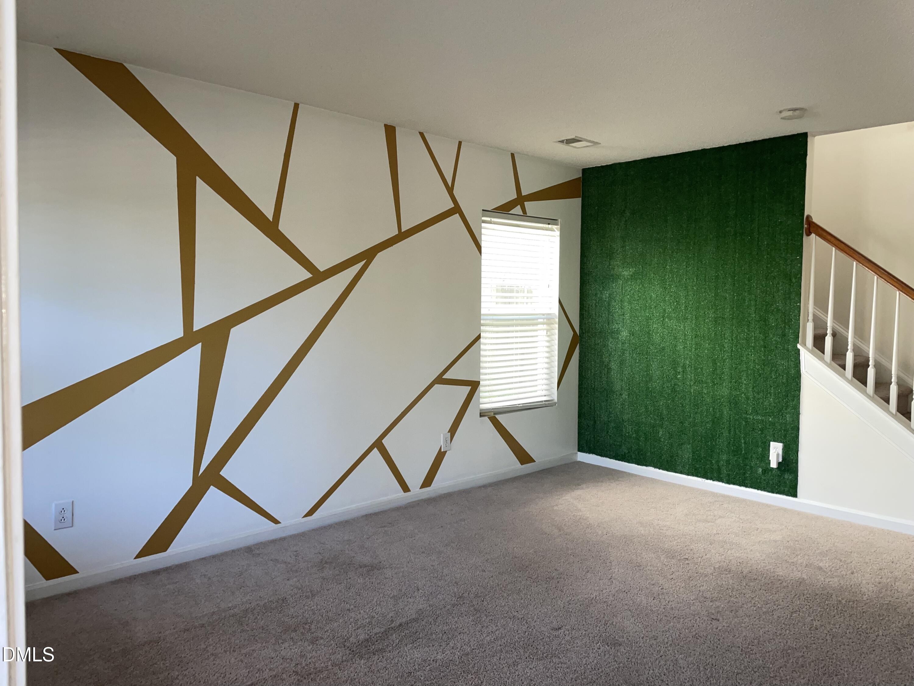 3616 Marshlane Way Raleigh, NC 27610 - Photo 4 of 24 a view of an empty room with staircase