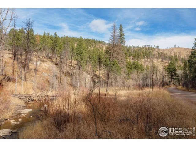 a view of a town with mountains in the background