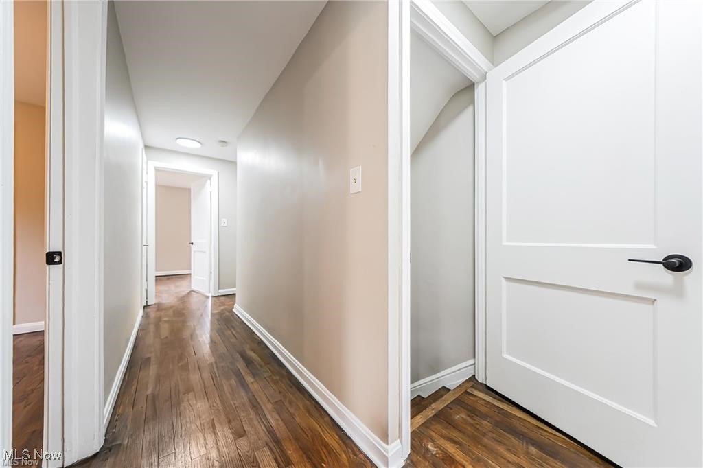 3837 Mayfield Road Cleveland, OH 44121 - Photo 8 of 29 Corridor featuring dark wood finished floors