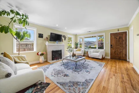 a kitchen with stainless steel appliances granite countertop a refrigerator sink and stove