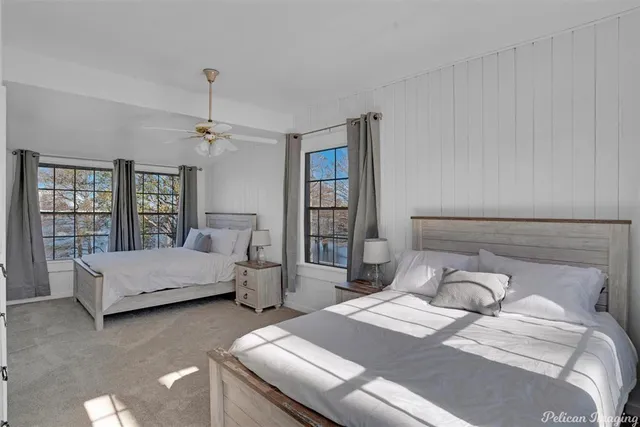 a bedroom with bed and window