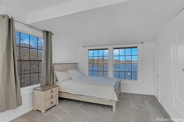 a bed room with a bed and a window