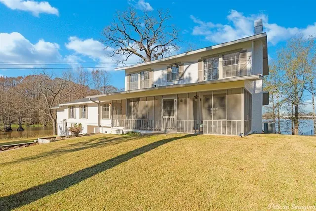 a front view of a building with a garden
