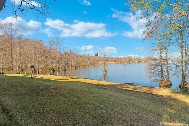 a large house with a large pool in front of it