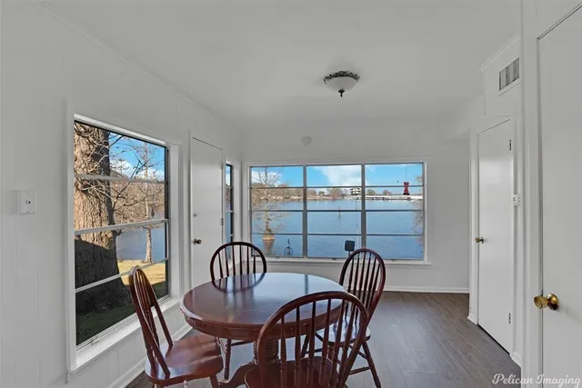 a view of a dining room with furniture window and outside view