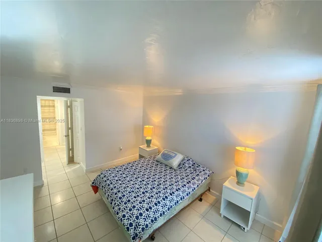 a bedroom with a bed and walk in closet