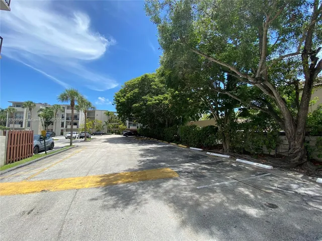 a view of backyard with swimming pool and outdoor seating
