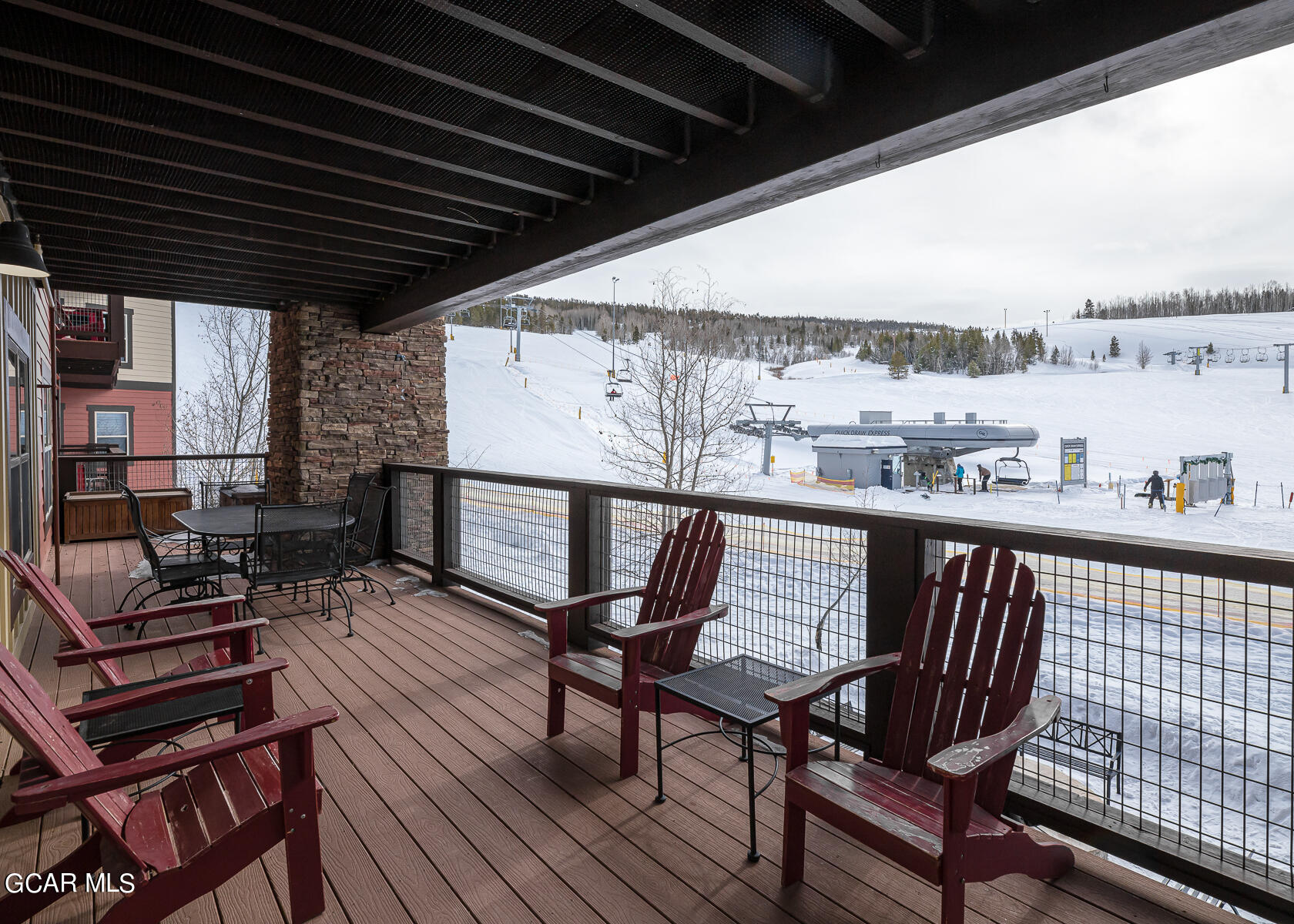 a view of a chairs and table on the deck