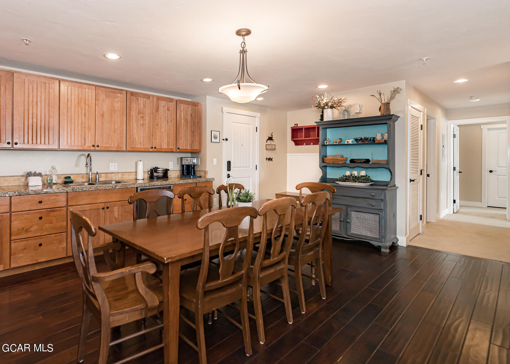 300 Base Camp Circle, Unit 208 Granby, CO 80446 - Photo 15 of 66 a view of a dining room with furniture and wooden floor