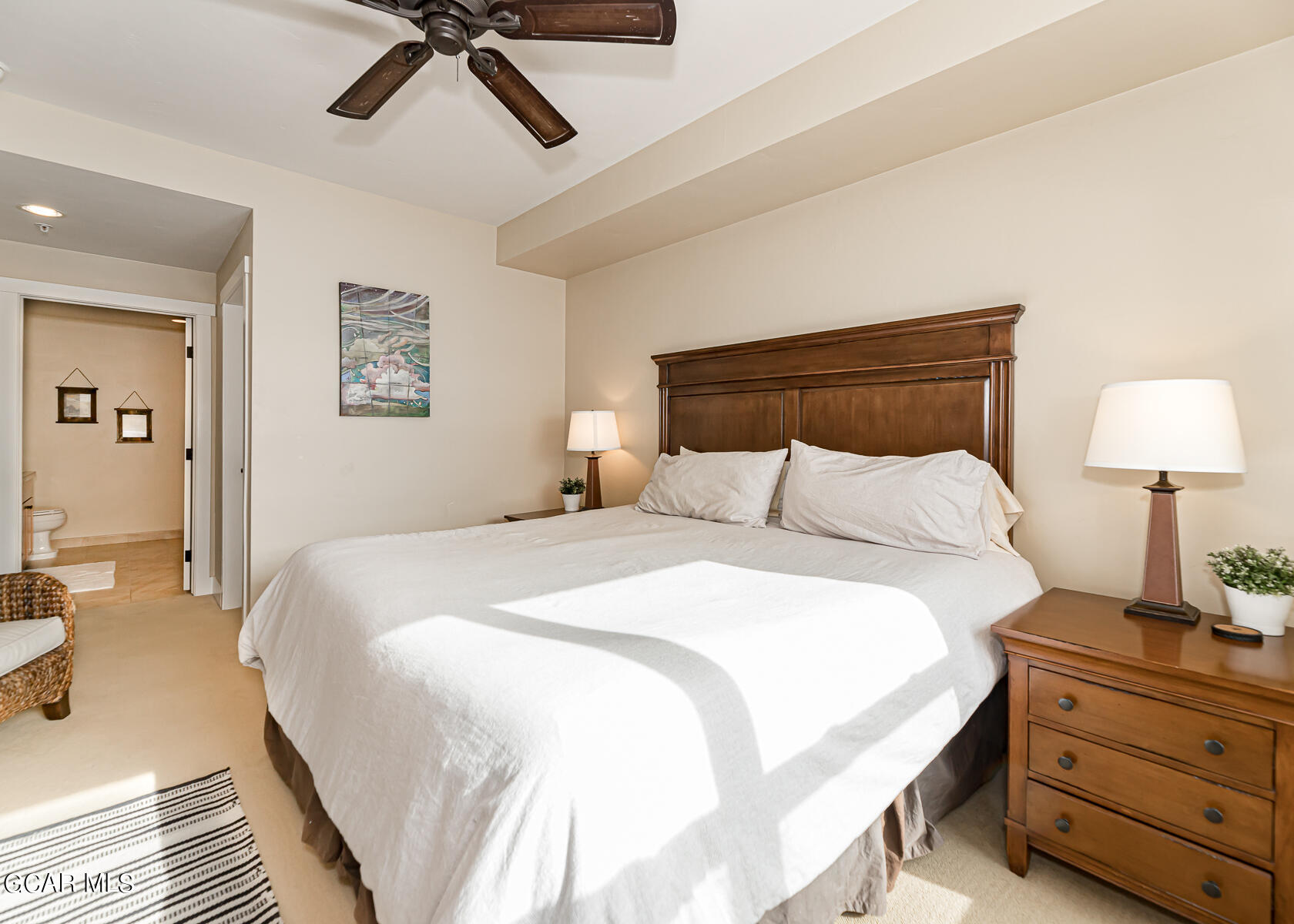 300 Base Camp Circle, Unit 208 Granby, CO 80446 - Photo 17 of 66 a bedroom with a bed and a lamp on the dresser