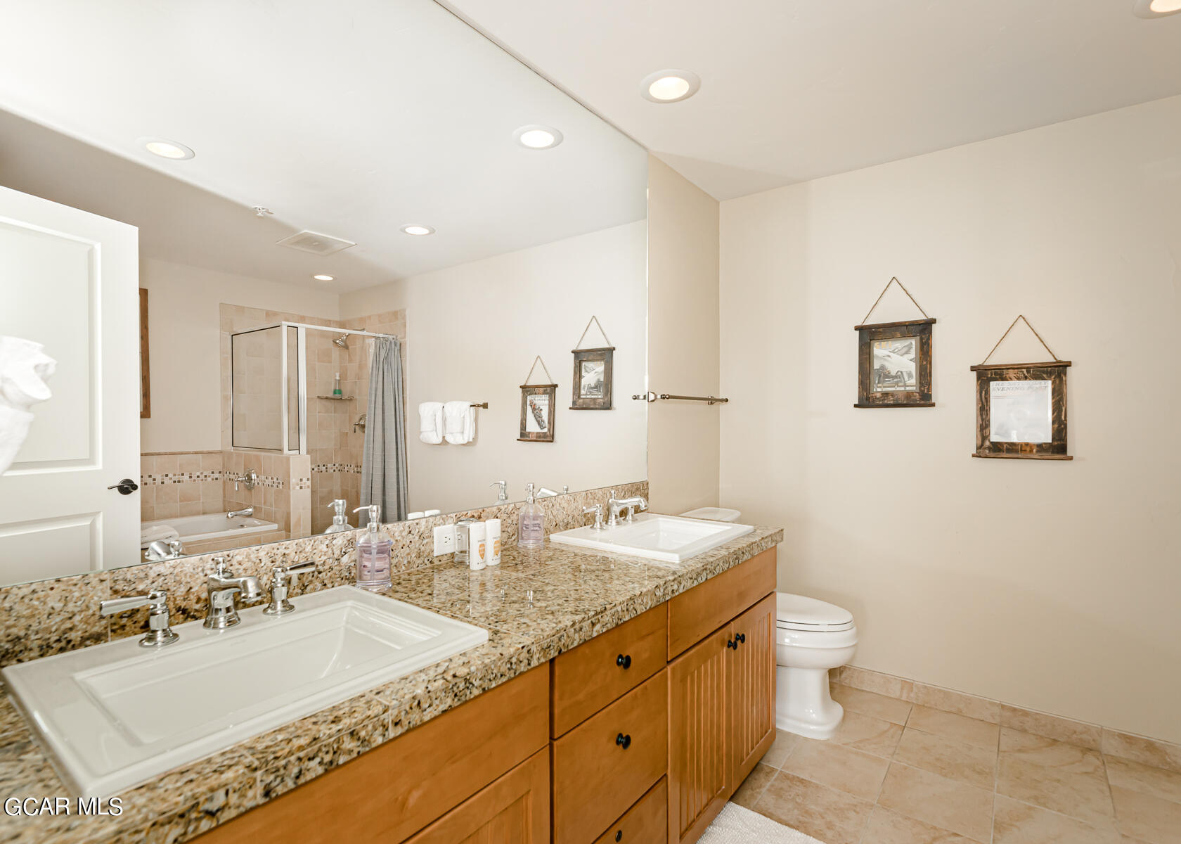 300 Base Camp Circle, Unit 208 Granby, CO 80446 - Photo 19 of 66 a bathroom with a granite countertop sink and a mirror