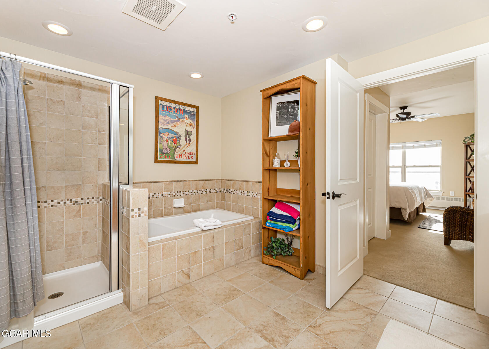 300 Base Camp Circle, Unit 208 Granby, CO 80446 - Photo 20 of 66 a bathroom with a tub shower and mirror