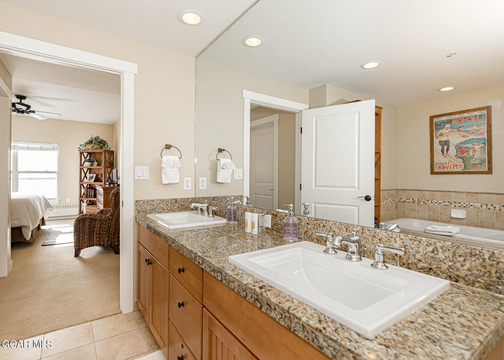 300 Base Camp Circle, Unit 208 Granby, CO 80446 - Photo 22 of 66 a spacious bathroom with a granite countertop double vanity sink and a mirror