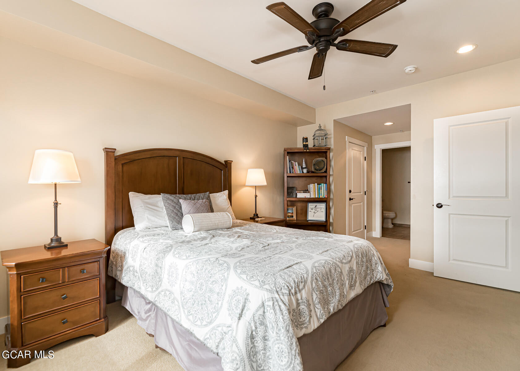 300 Base Camp Circle, Unit 208 Granby, CO 80446 - Photo 24 of 66 a bedroom with a bed and a chandelier