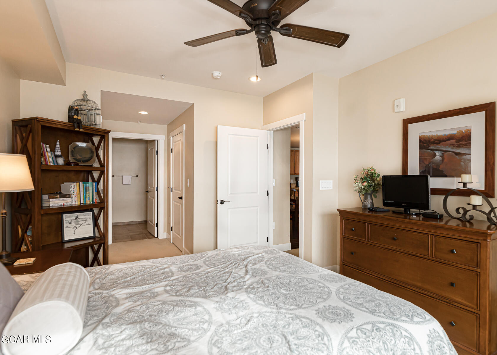 300 Base Camp Circle, Unit 208 Granby, CO 80446 - Photo 25 of 66 a bedroom with a bed and a chandelier