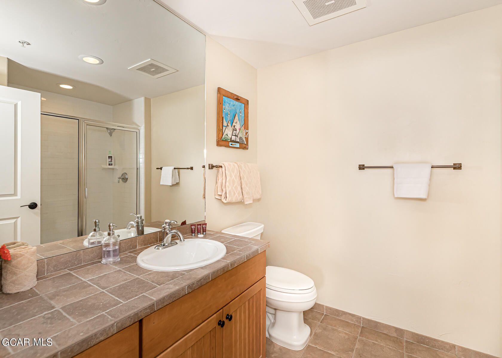 300 Base Camp Circle, Unit 208 Granby, CO 80446 - Photo 26 of 66 a bathroom with a granite countertop sink a toilet and a mirror