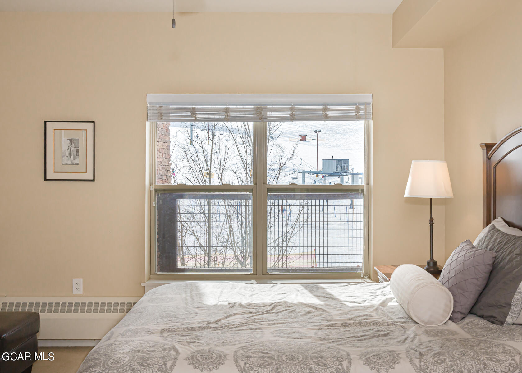 300 Base Camp Circle, Unit 208 Granby, CO 80446 - Photo 33 of 66 a large bed sitting in a bedroom next to a window