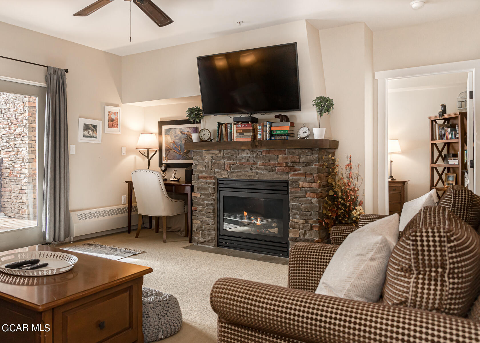 300 Base Camp Circle, Unit 208 Granby, CO 80446 - Photo 37 of 66 a living room with furniture and a flat screen tv