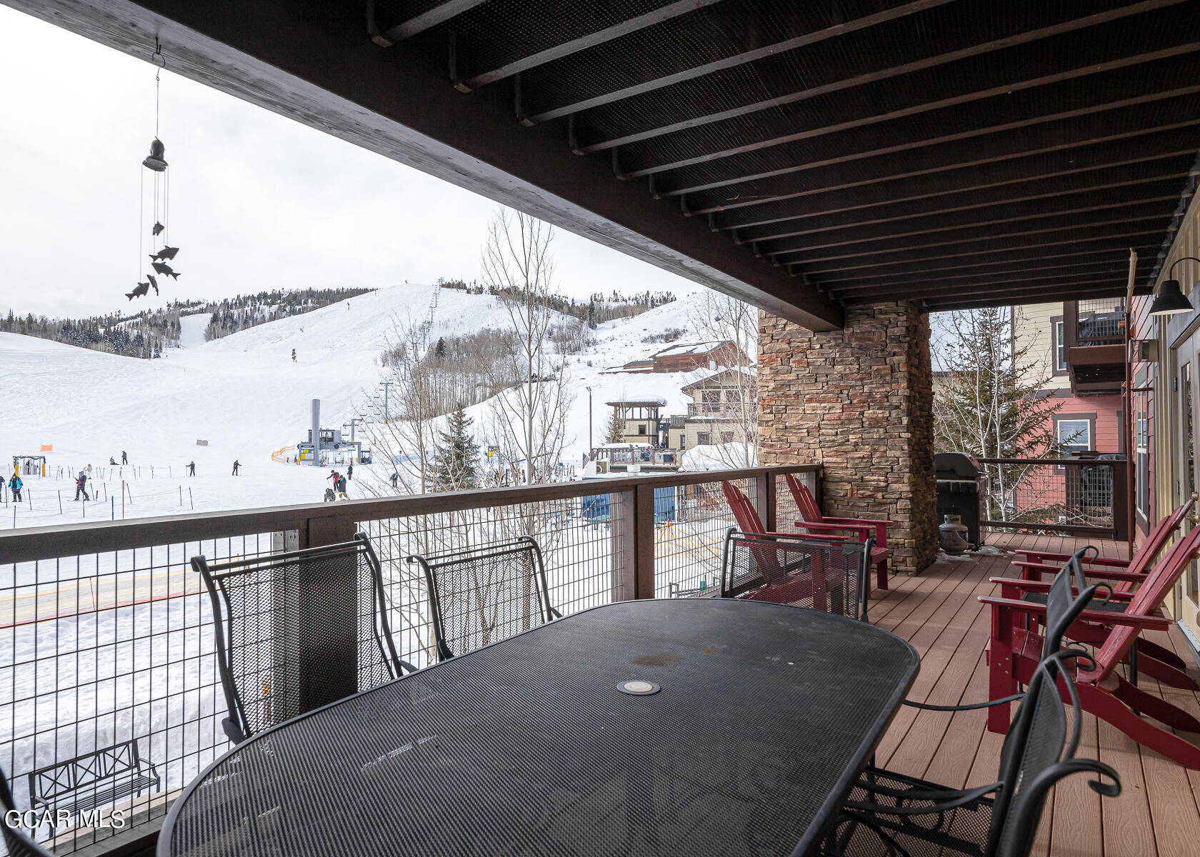 300 Base Camp Circle, Unit 208 Granby, CO 80446 - Photo 43 of 66 a view of a chairs and table in the balcony