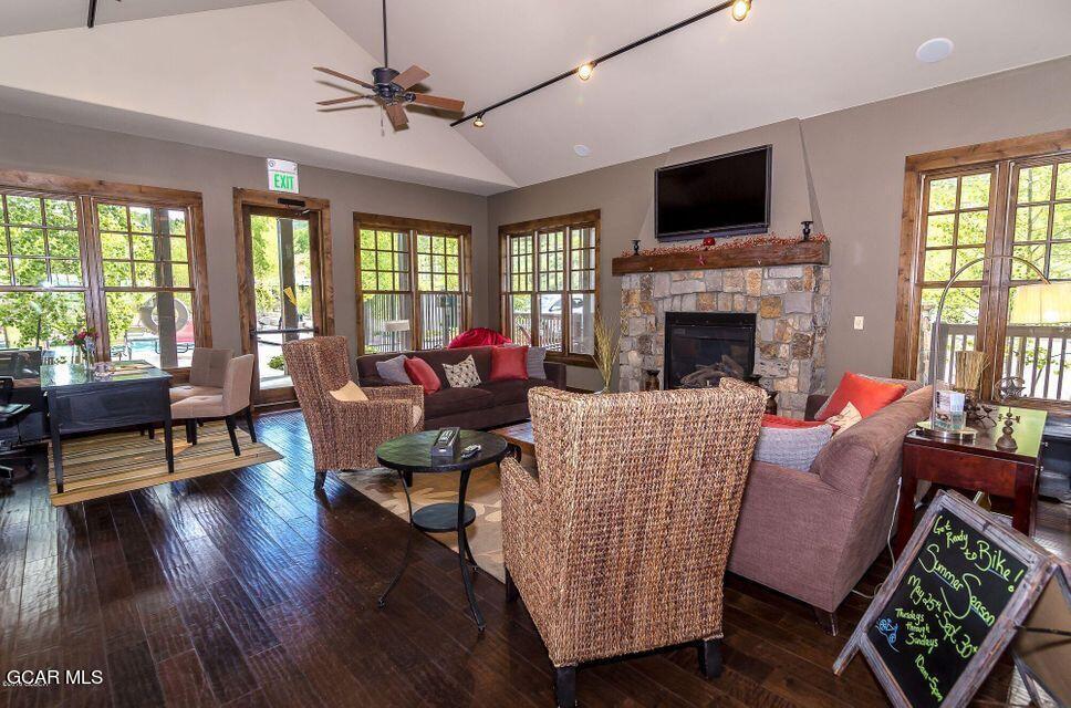 300 Base Camp Circle, Unit 208 Granby, CO 80446 - Photo 57 of 66 a living room with furniture a flat screen tv and a fireplace