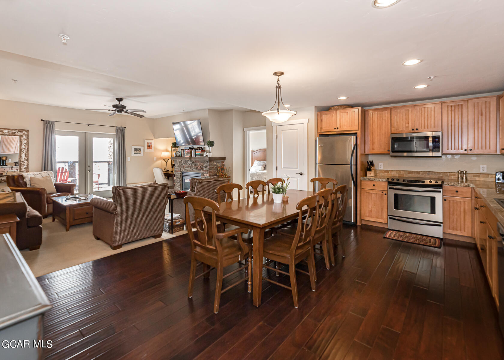 300 Base Camp Circle, Unit 208 Granby, CO 80446 - Photo 6 of 66 a view of a dining room with furniture wooden floor and chandelier