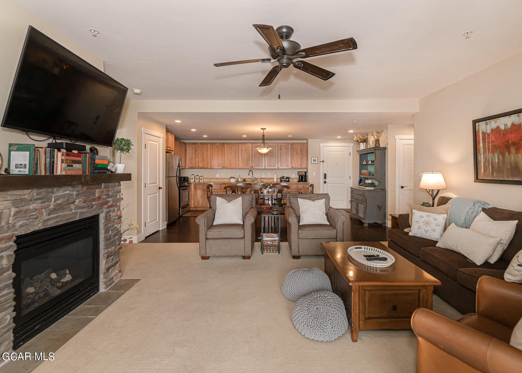 300 Base Camp Circle, Unit 208 Granby, CO 80446 - Photo 7 of 66 a living room with furniture a flat screen tv and a fireplace