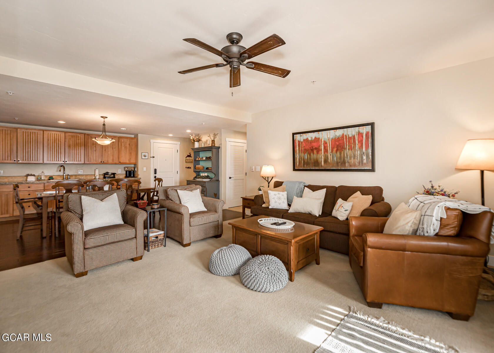 300 Base Camp Circle, Unit 208 Granby, CO 80446 - Photo 9 of 66 a living room with couches with kitchen view