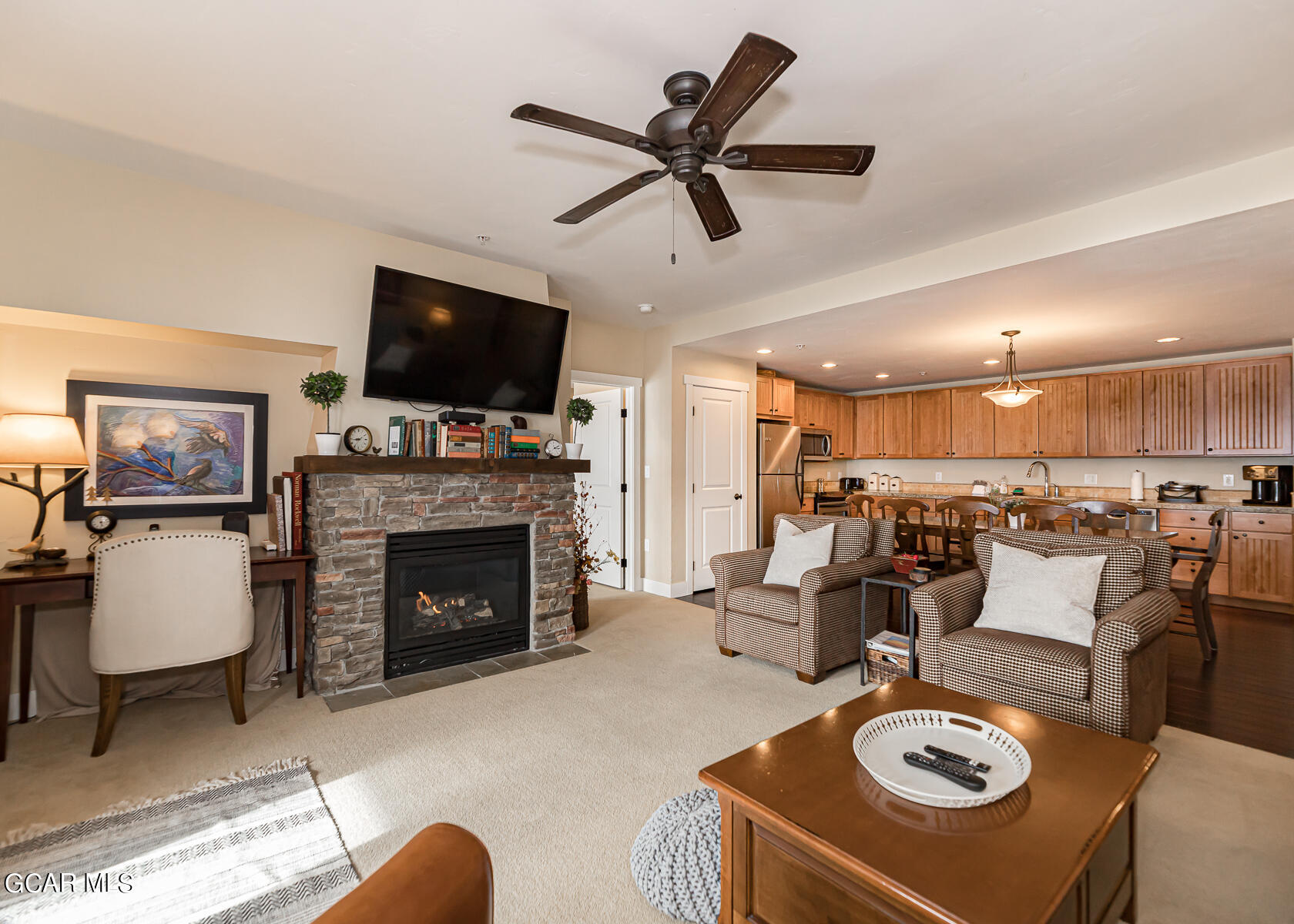 300 Base Camp Circle, Unit 208 Granby, CO 80446 - Photo 10 of 66 a living room with furniture a flat screen tv and a fireplace