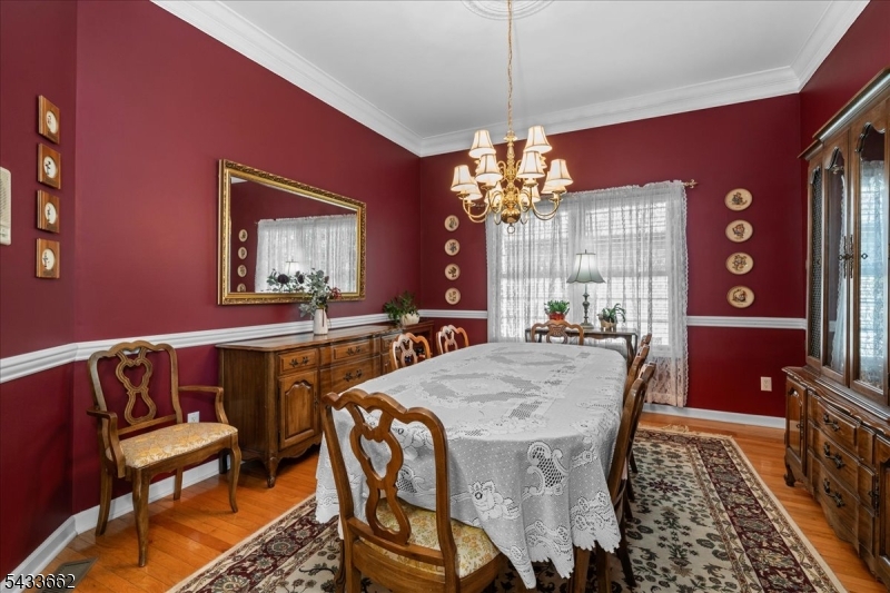 15 Bracken Hill Road Hamburg, NJ 07419 - Photo 11 of 44 a view of a dining room with furniture and chandelier