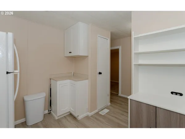a bathroom with a sink a toilet and a shower