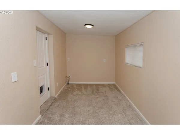 a bedroom with a bed and a table