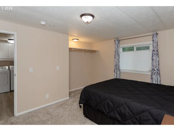 a bedroom with a bed and a cabinets