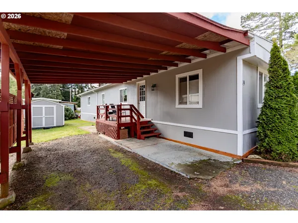 a backyard of a house with yard and garage